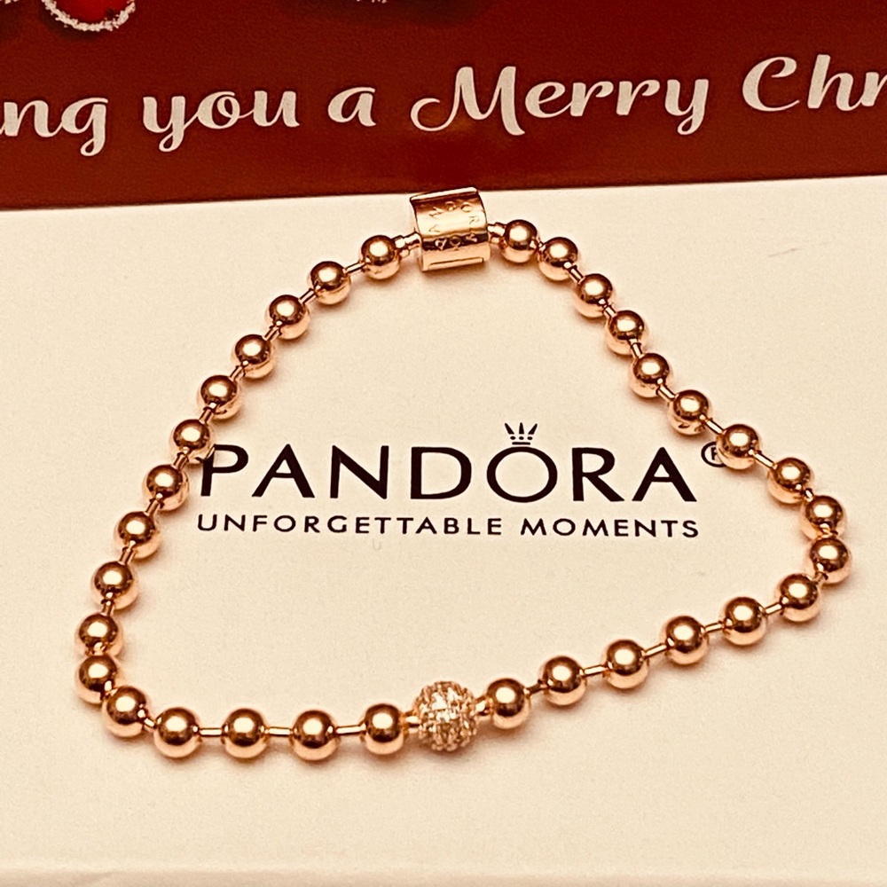 Pandora beads and pave bracelet size 7.5 inches. Rose gold comes with pouch.